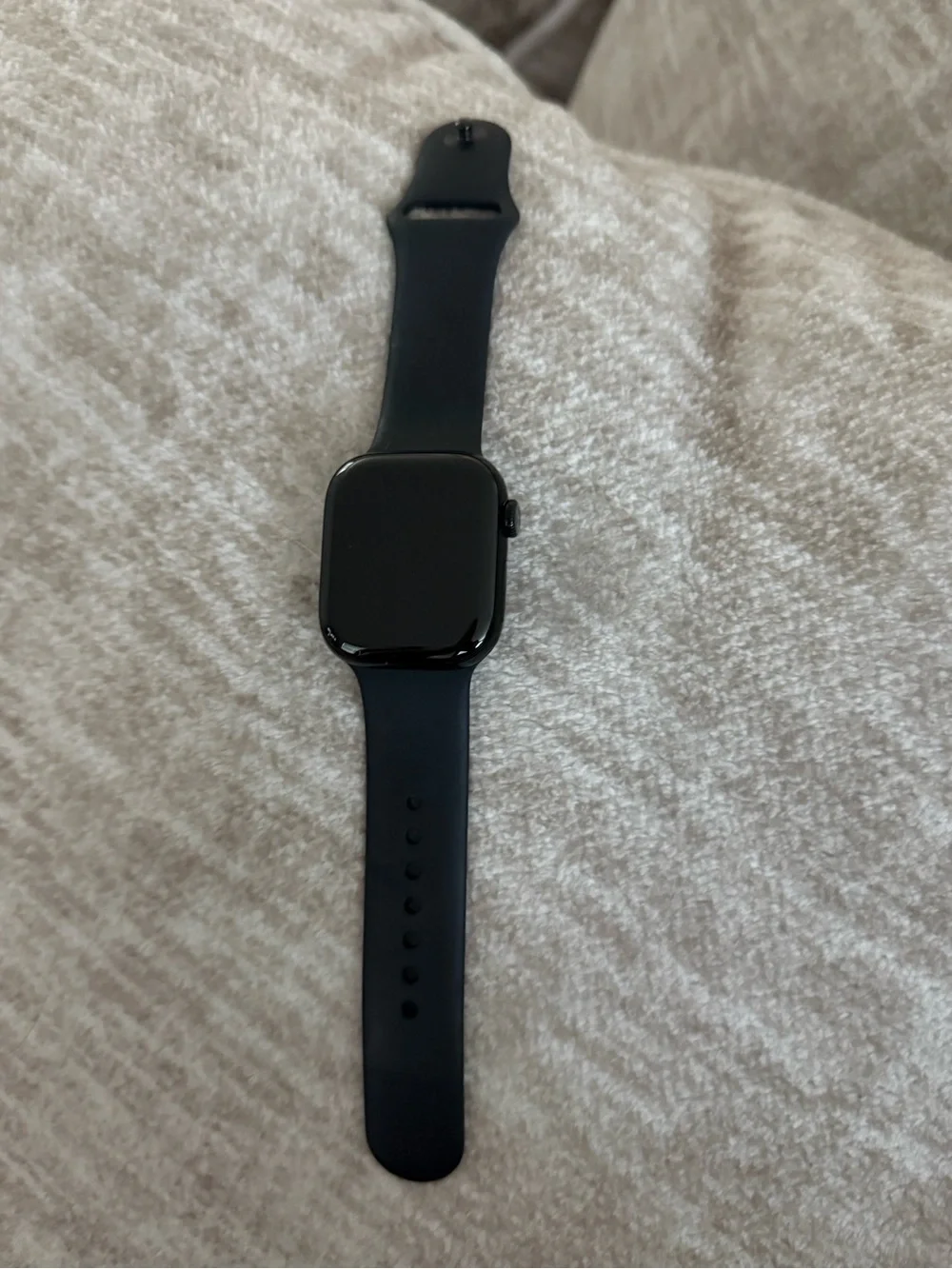 Apple Watch Series 11. GPS. 44mm Jet black aluminum case with black sport band.